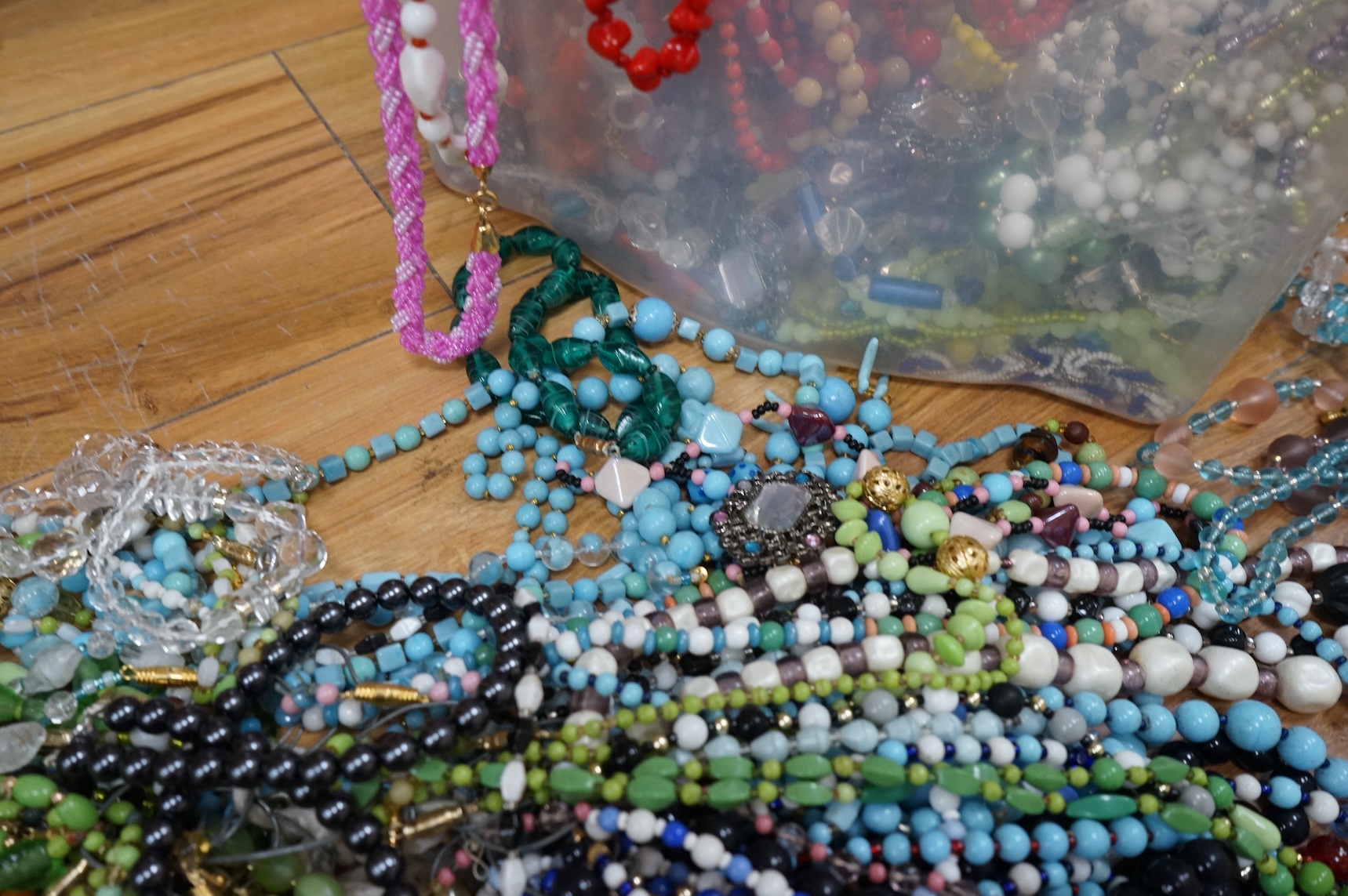 A large collection of glass bead necklaces